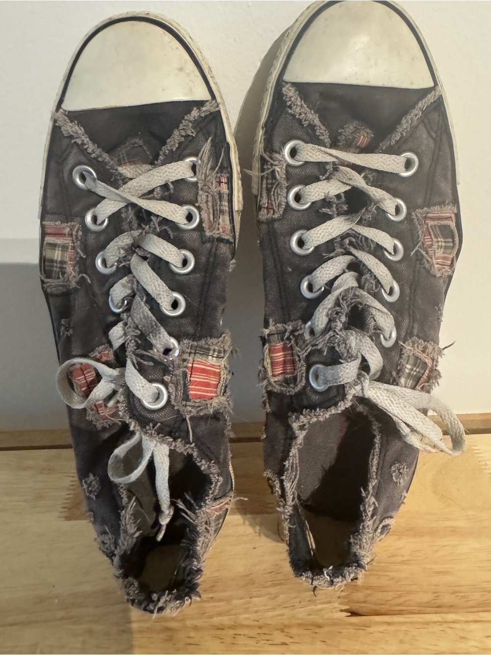Converse Frayed Black Canvas Sneakers with Red Insole Accent